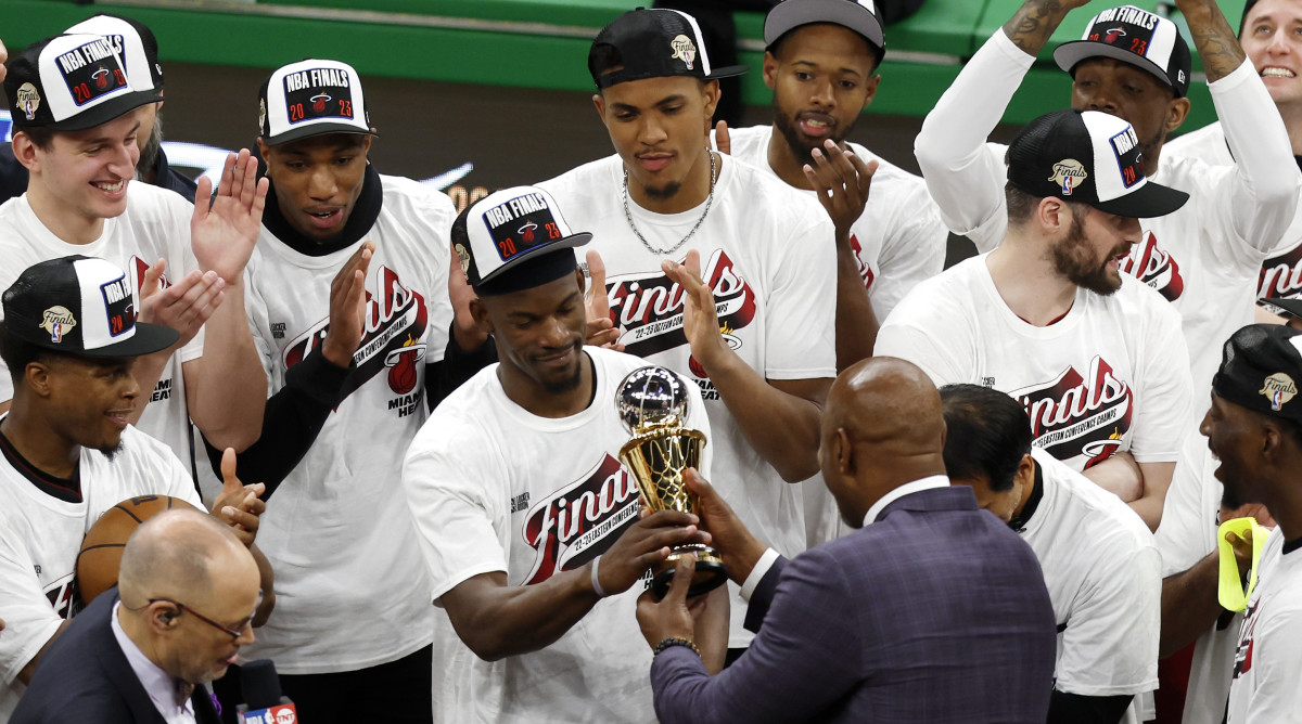Heat guard Jimmy Butler is presented with the the Larry Bird Trophy after winning Game 7 against Celtics